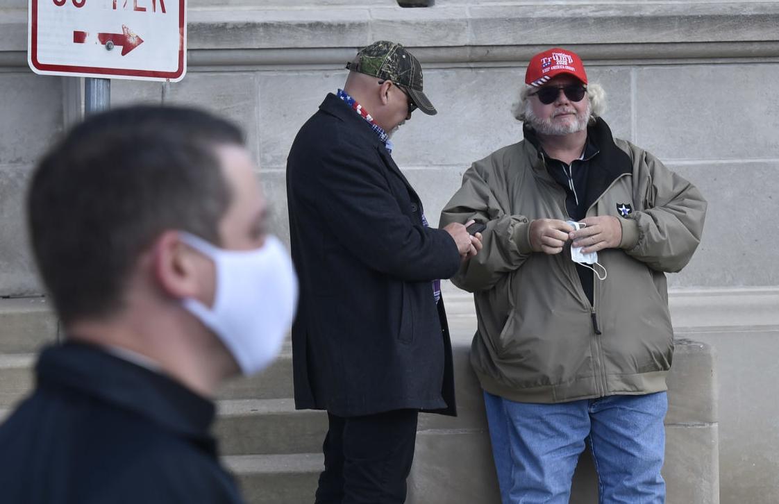 Two men in Trump hats attend Unite Our Nation event in Kenosha Sunday